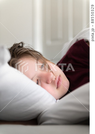 Sleepy teenager girl in bed Sleepy teenager girl in bed 88550329