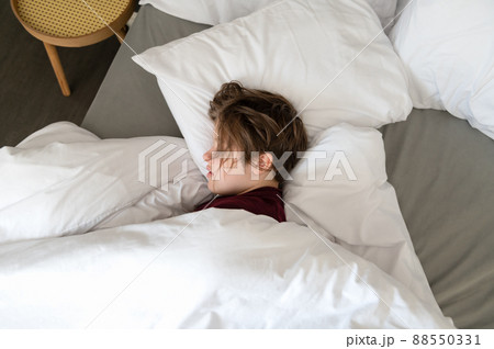 Sleepy teenager girl in bed Sleepy teenager girl in bed 88550331