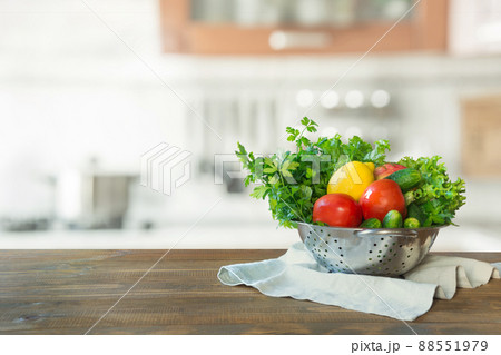 Blurred kitchen with vegetables on tabletop. Space for design. 88551979
