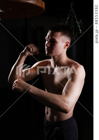 Blows the athlete bag boxer The practices glove black young male competition, In the afternoon strength muscle in punch for fit lifestyle, sportswear sweat. Person active box, one 88553592