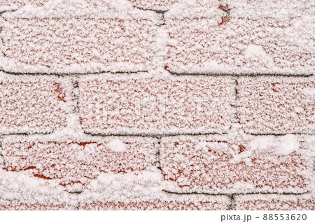 The brick wall is covered with snow patterns The brick wall is covered with snow patterns 88553620