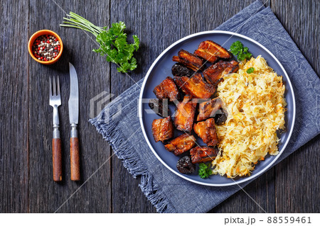 braised sauerkraut with pork and prunes on plate braised sauerkraut with pork and prunes on plate 88559461