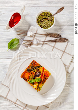 a portion of baked in oven vegetable frittata a portion of baked in oven vegetable frittata 88559469