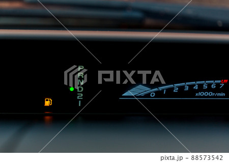 Empty fuel warning light in car dashboard. Fuel pump icon. 88573542