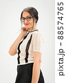 Studio photo of middle aged woman starting getting grey-haired wearing black and white clothes on white background, middle age sexy lady, happy life concept 88574765