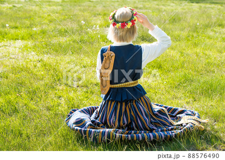 Woman in traditional clothing posing on nature in village. Woman in traditional clothing posing on nature in village. 88576490