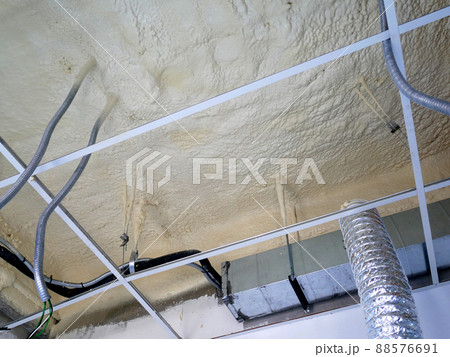 SELANGOR, MALAYSIA - MARCH 10, 2022: Polyurethane insulating foam that has been sprayed and covered the surface below the concrete slabs. Serves as a layer of thermal insulation for the building. 88576691