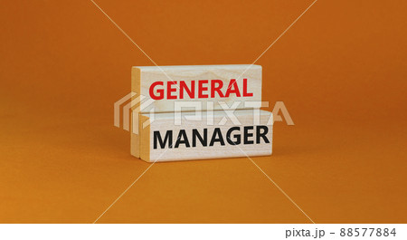 General manager symbol. Concept words General manager on wooden blocks on a beautiful orange background. Business and general manager concept. Copy space. 88577884