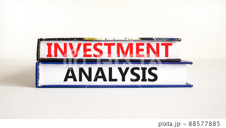 Investment analysis symbol. Books with concept words Investment analysis on beautiful white background. Business investment analysis concept. Copy space. 88577885