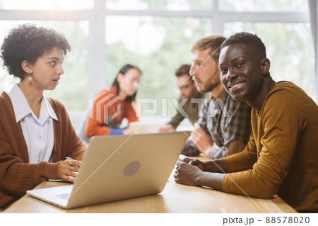 business woman communicates with a client sitting at a table in business woman communicates with a client sitting at a table in 88578020