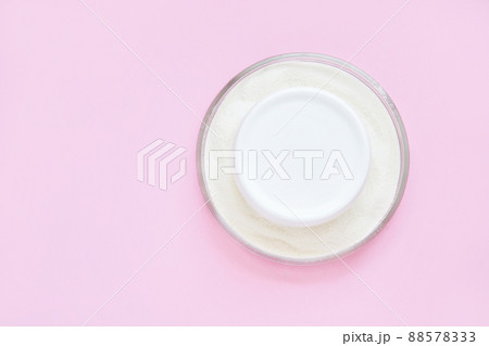Collagen white powder. Pastel color background. Health product. Woman cosmetics 88578333