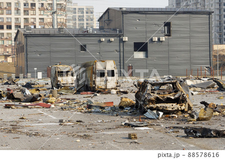 Aftermath shell of civilian bombed city damage car. 2022 Russian invasion of Ukraine war torn city destroyed car burn out. Bomb attack Russia war damage Ukraine city war destruction Russian aggression Aftermath shell of civilian bombed city damage car. 2022 Russian invasion of Ukraine war torn city destroyed car burn out. Bomb attack Russia war damage Ukraine city war destruction Russian aggression 88578616