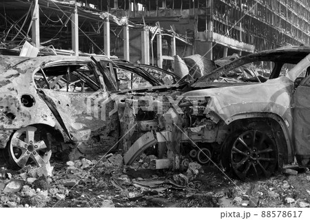 Aftermath shell of civilian bombed city damage car. 2022 Russian invasion of Ukraine war torn city destroyed car burn out. Bomb attack Russia war damage Ukraine city war destruction Russian aggression Aftermath shell of civilian bombed city damage car. 2022 Russian invasion of Ukraine war torn city destroyed car burn out. Bomb attack Russia war damage Ukraine city war destruction Russian aggression 88578617
