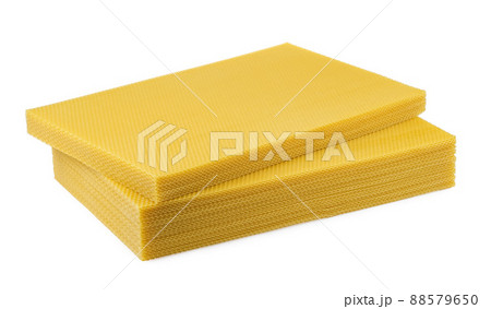 Beeswax. Wax base for honey bee rebuilding on a white background. Honeycombs. 88579650