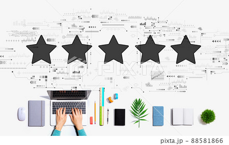 Rating star concept with person using a laptop Rating star concept with person using a laptop 88581866
