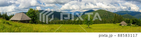 Beautiful nature and a wonderful landscape around a wooden hut, in a clearing located on the slopes of the Carpathian Mountains above Lake Synevyr. Ukraine. 88583117