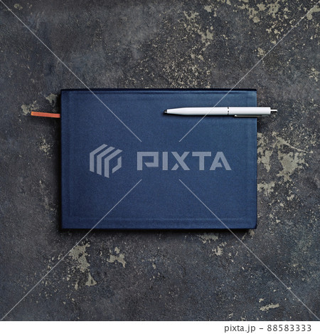 Closed notepad and pen 88583333