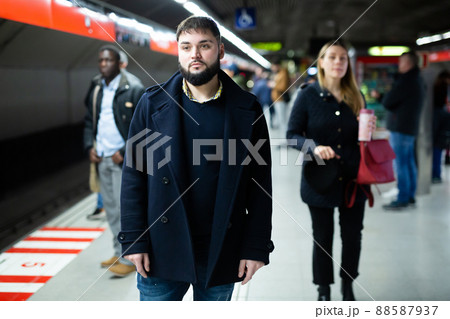 Young man waiting for subway train Young man waiting for subway train 88587937