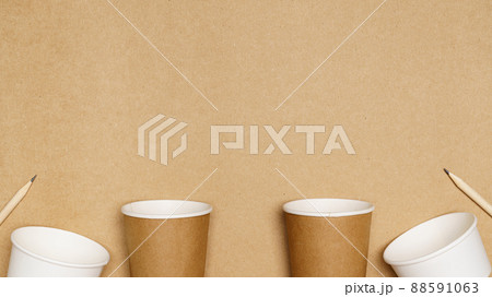 Eco friendly concept, Consist of paper cup and pencil with cotton buds on wooden background Eco friendly concept, Consist of paper cup and pencil with cotton buds on wooden background 88591063