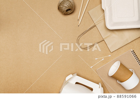 Eco friendly concept, Delivery food container on paper bag and notebook pencil with jute rope Eco friendly concept, Delivery food container on paper bag and notebook pencil with jute rope 88591066