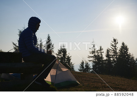One man having rest in campsite in fresh air. One man having rest in campsite in fresh air. 88592048