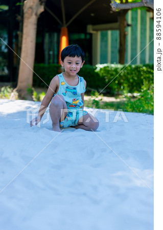 Little Boy on playground in sandpit. Little Boy on playground in sandpit. 88594106