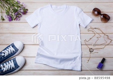 Womens white T-shirt mockup with burdock flowers 88595498