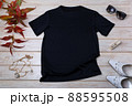 Womens black T-shirt mockup with white heels and grass 88595508