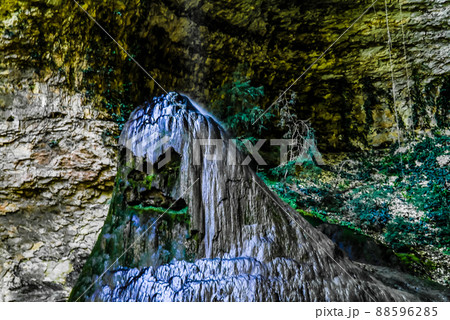 View to stalagmite under the Shakuran waterfall in Abkhazia, Geo View to stalagmite under the Shakuran waterfall in Abkhazia, Geo 88596285