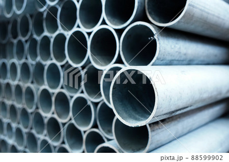 New metal pipes of same diameter are stacked. Pipes for gasification or water supply. Industrial 88599902