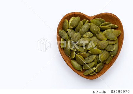 Pumpkin seeds on white background 88599976