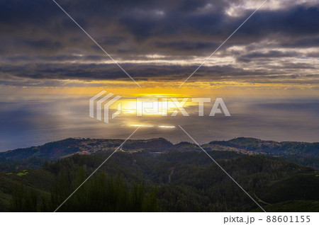 Sunset over Atlantic Ocean with coastal villages in Madeira, Portugal Sunset over Atlantic Ocean with coastal villages in Madeira, Portugal 88601155