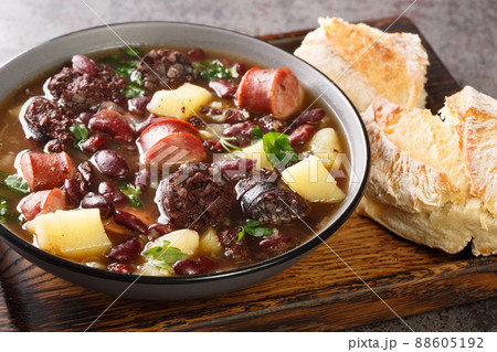 Slow Cooked Portuguese Stone Soup or Sopa da Pedra closeup in the plate. Horizontal Slow Cooked Portuguese Stone Soup or Sopa da Pedra closeup in the plate. Horizontal 88605192
