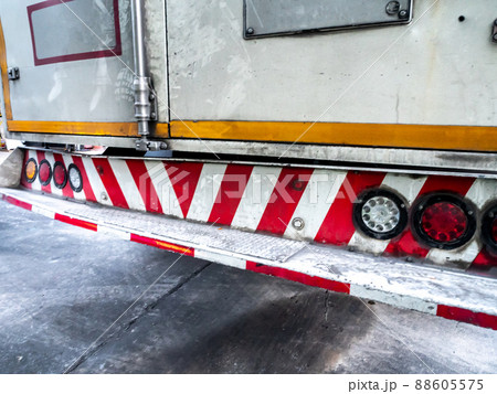 Red and white striped sign of truck rear bumper Red and white striped sign of truck rear bumper 88605575