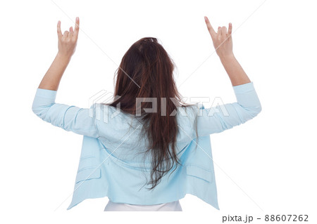 Young girl posing back with the horns gesture 88607262