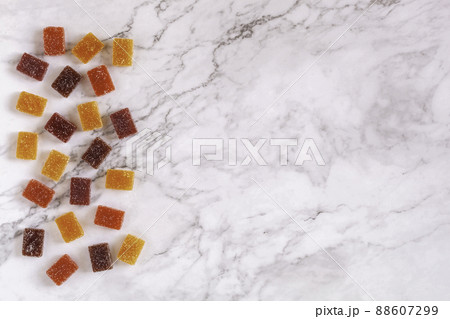 Different tastes of fruit paste on marble background, top view, copy space 88607299