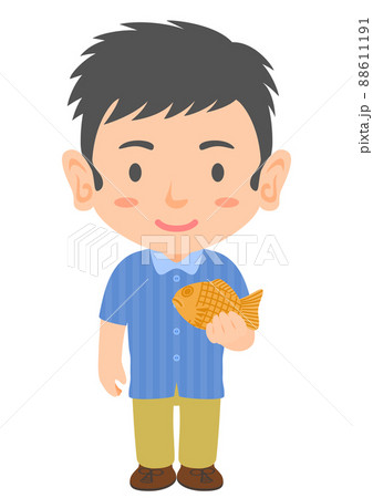 たい焼きを食べる男性 88611191