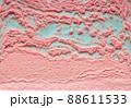 Pink crumbly background on a turquoise basis. 88611533