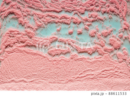 Pink crumbly background on a turquoise basis. 88611533