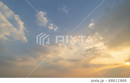 Sunset sky. Abstract nature background. Dramatic blue with orange colorful clouds in twilight time. Sunset sky. Abstract nature background. Dramatic blue with orange colorful clouds in twilight time. 88612866