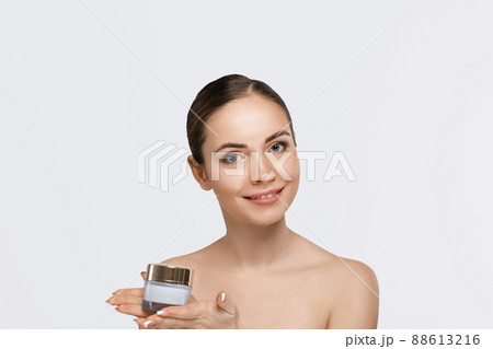 Skin care. Beautiful Pretty Woman Holding Cosmetic Cream.Girl with fresh skin. Spa. Beauty Concept. Female with fresh makeup and Perfect Skin. Skin care. Beautiful Pretty Woman Holding Cosmetic Cream.Girl with fresh skin. Spa. Beauty Concept. Female with fresh makeup and Perfect Skin. 88613216