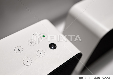 Hi-tech buttons on modern white stereo sound speaker, digital loudspeaker 88615228