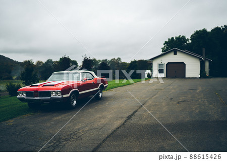 Vintage car parked near old barn Vintage car parked near old barn 88615426