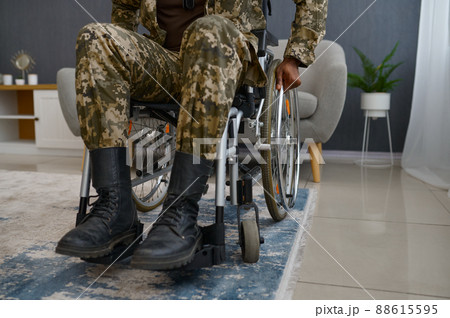 War veteran with disability sitting in wheelchair War veteran with disability sitting in wheelchair 88615595