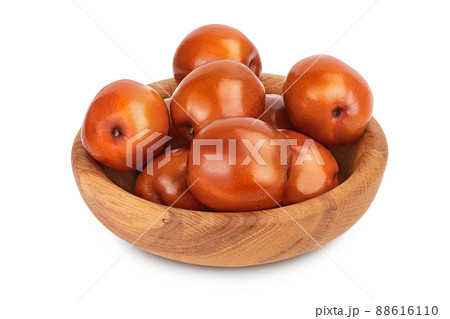jujube or chinese date in wooden bowl isolated on white background with clipping path and full depth of field jujube or chinese date in wooden bowl isolated on white background with clipping path and full depth of field 88616110