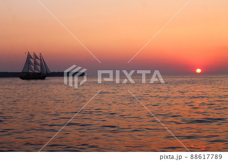 The sailing vessel and the colored sunset The sailing vessel and the colored sunset 88617789