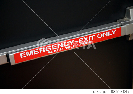 Emergency exit only alarm wall push handle on a black security door 88617847
