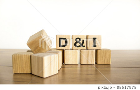 D and I, Diversity and inclusion symbol. Concept words D and I, diversity and inclusion on wooden cubes on beautiful wooden table, white background. Business, D and I, diversity and inclusion concept. 88617978