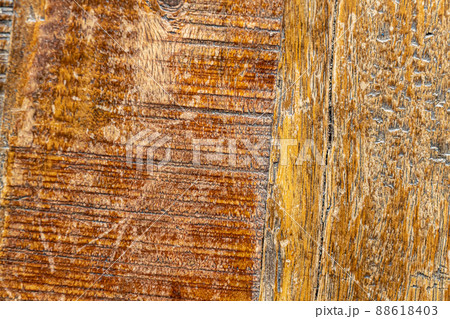 Brown wood texture of old wooden table with many scratches and marks of use 88618403