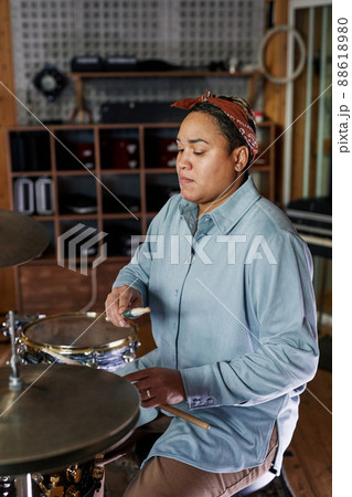 Woman Playing Drums in Studio Woman Playing Drums in Studio 88618980